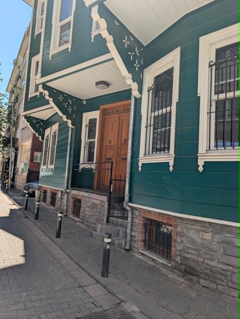Ottoman houses in one of Istanbul's historic neighborhoods, their colorful facades softened by time.